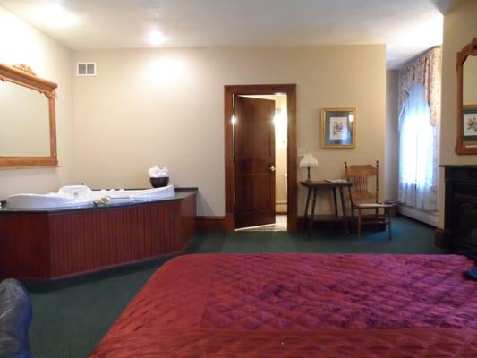 Premium room with Jacuzzi. The fireplace is off to the right, don't mind my dirty boot, haha.