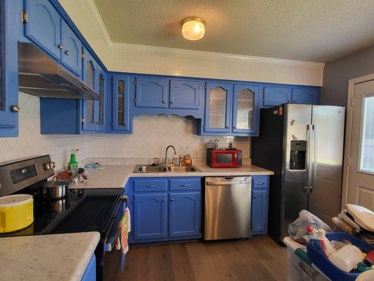 Backsplash, countertops, Painted cabinets and installed glass