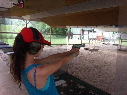 My daughter shooting a .22.