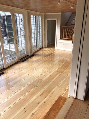 Wide pine flooring coated with an oil based sealer and three topcoat of a high-performance water-based product.  Peaks Island