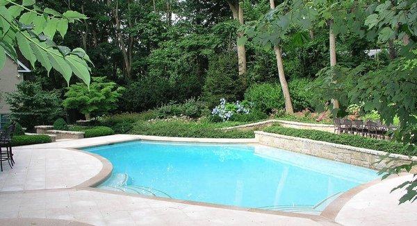 Contemporary swimming pool and patio design for a Roslyn Heights home in Nassau County of Long Island.