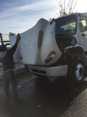 Waxing a semi truck.