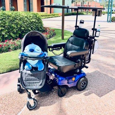 Stroller attachment for electric wheelchair