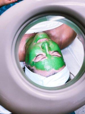 Relaxing while her enzyme mask rehydrated and firms her skin.