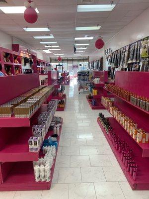 Interior (dye products near front, various hair products further back, braid hair on right wall)