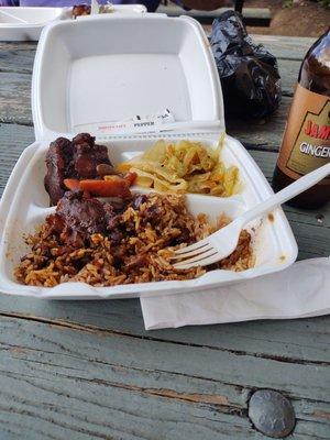 Oxtails lunch with rice and peas, and cabbage ,new location! Hubby is having Jerk chicken, plantains, . and rice