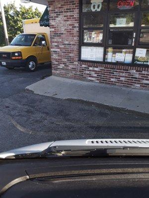 A steep dip in the sidewalk, to the left of center, that nearly caused me to trip