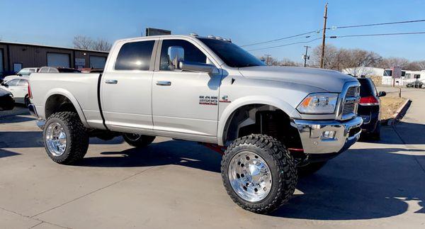 Now that's FRESHHHHHH!! 6.5 Zone lift kit on this gorgeous Cummins diesel 2500 on 22 inch Alcoa wheels. Powder coated illusion cherry!!