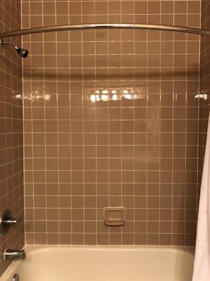 Clean tiled shower and tub