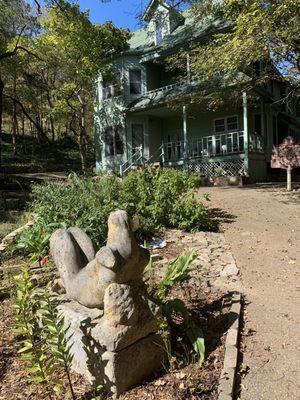 Sculpture in the front lawn and house.