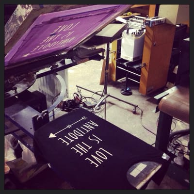 Manual screenprinting on our 8-color press