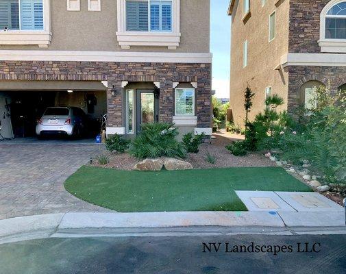 Artificial turf was incorporated to make this yard more appealing. It was all decorative rock before.