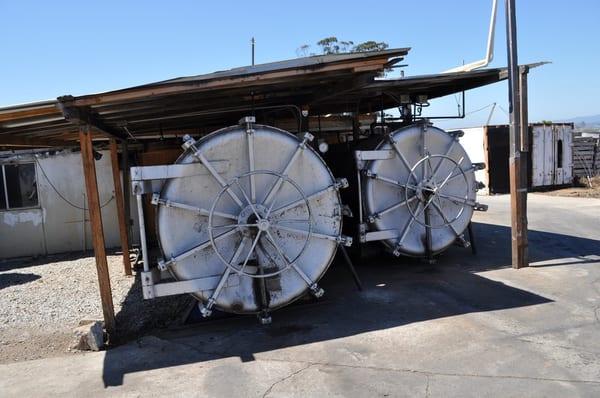 Huge sterilization boilers steam sterilize the sawdust blocks before spawn is introduced.