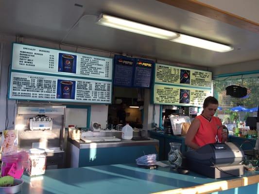 The interior counter where numerous orders for burgers and shakes are made.