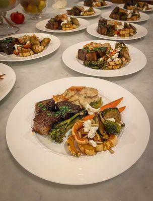 Red wine braised short ribs with roasted seasonal vegetables, chèvre, pepitas, Calabrian chili, and Yukon gold and sweet potato gratin.