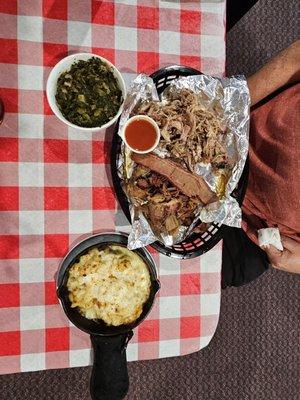 The two meat sampler with macaroni and cheese and collards