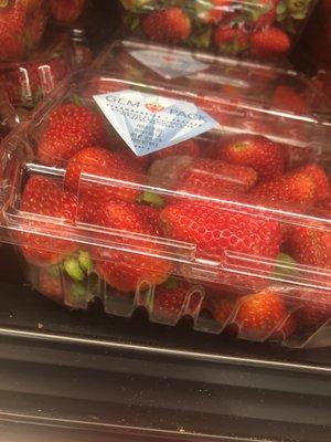 Molding strawberries;the produce needs to be maintained, long lines and lack of freshness, too many people steal; empty wrappers all over