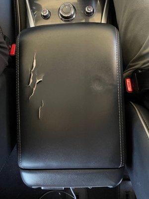 (Before) damaged armrest of a Infiniti QX60.