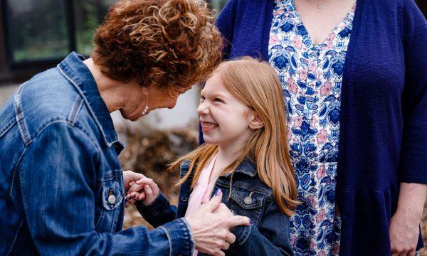 A grandmother and grandchild share a laugh at the Klehm Arboretum and Botanic Garden in Rockford IL