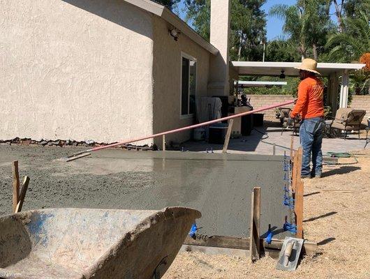 Ivan smoothing the concrete