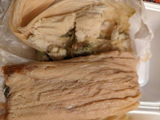 The top tamal was uncooked, I opened this one first and didn't realize until I took a bite. Pic shows the difference.