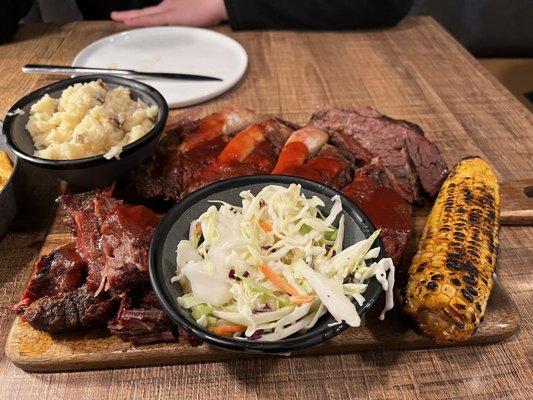 Combo platter - burnt ends, ribs and brisket. Coleslaw by default. Chose the mash and grilled corn.