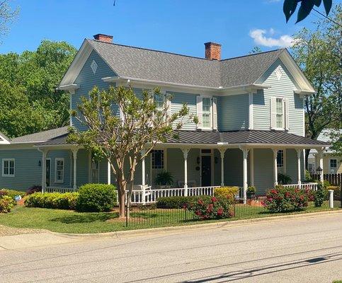 Beautiful historic house in downtown Apex with Certainteed Landmark Driftwood shingles and dark bronze standing seam metal.