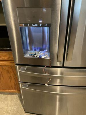 appliance - GE Refrigerator not making ice or dispensing water due to a defective inlet valve.