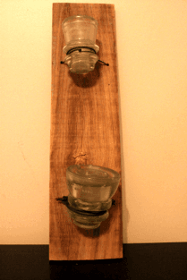 Old glass insulator and barnwood wall mounted planter