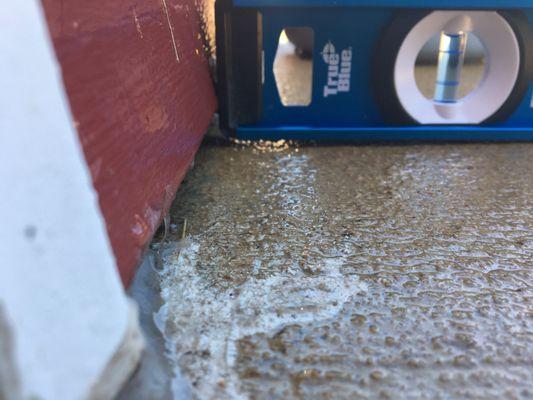 water was running under the wall into the garage. The stain is where I had to goop it full of sealant to try and stop it.