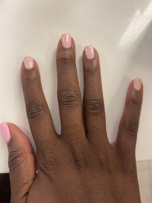 Gel manicure. Thumb and pinky are completely different colors in normal light, overly square shape, and see through/patchy gel polish