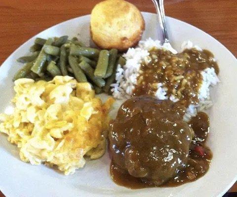 Salisbury steak with white rice Mac n cheese green beans and cornbread