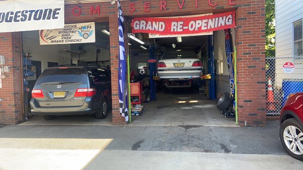 Garage full of cars working on brake jobs and trans flush