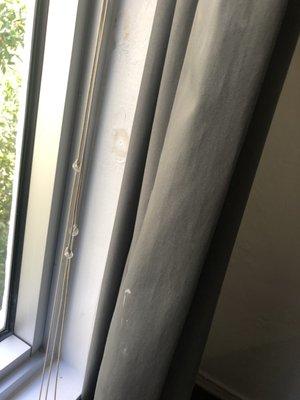 Stain on curtain and wall