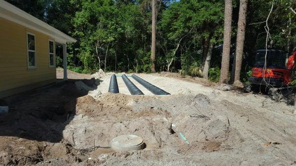 A new construction project underway. OE Smith's Sons hired to install a new drain field and septic system.