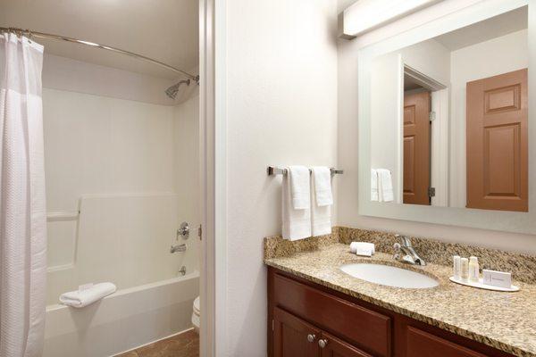 Guest bathrooms in our two-bedroom suites feature separate shower and vanity areas, complete with luxurious bath amenities.