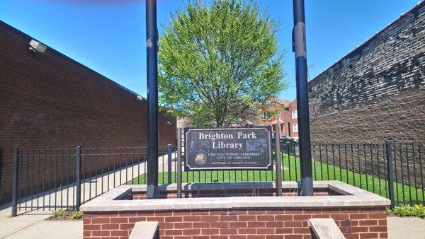 Walkway /Parkway east of Brighton Park Library that connects front of the building to parking lot in back of the building