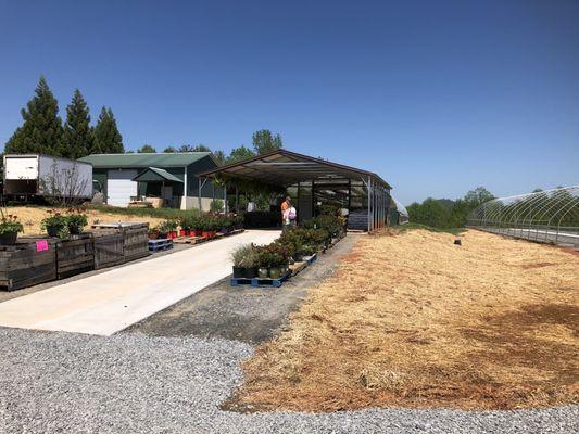 The first green house appears to be completed with a second one under construction