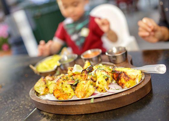 Seafood Trio Platter $36 "tiger prawn, salmon, sea bass skewered in clay oven served with veg pulau"