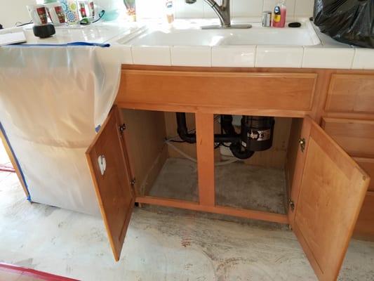 Water damage to Kitchen Cabinets. Insurance solution was to support the countertop and replace the cabinet box. Jenesis replaced countertop.