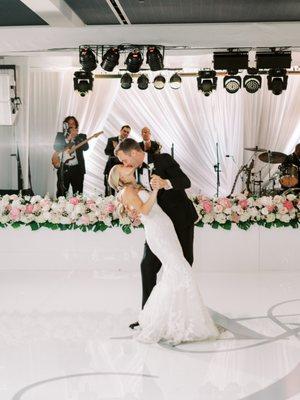 This is just the tip of the iceberg but the gorgeous draping, beautiful up lighting, florist, monogrammed dance floor...all Beth!