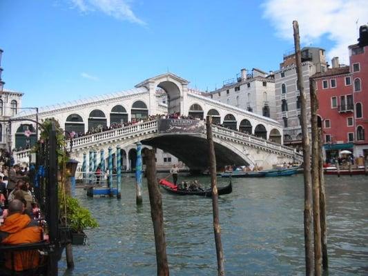 Taking a Gondola Ride under the Rialto Bridge in Venice Italy.