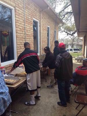 Men working their magic at the annual Fish Fry!