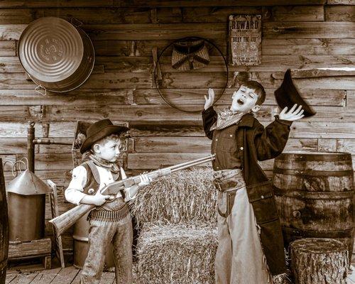 Two brothers showing us how wild the west really was at Doc Ike's Old Time Photo.