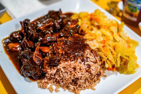 Oxtail with rice and peas and cabbage