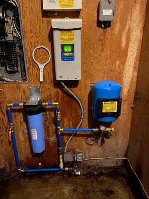 What Thomas and his help did. As a union plumber I give kudos to a clean look of the new well filter and control box with bladder tank.