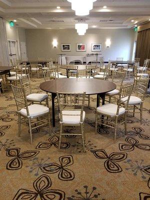 Quinceanera held at a local hotel featuring gold chiavari chairs with ivory cushions.