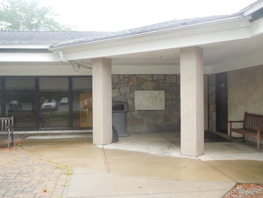 Wider view of rear entrance- sculpture by the door