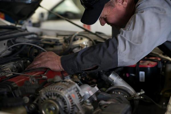 Making final adjustments on a after market turbo installation