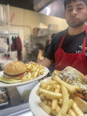 Cheese burger with fries and a steak and cheese deluxe combo